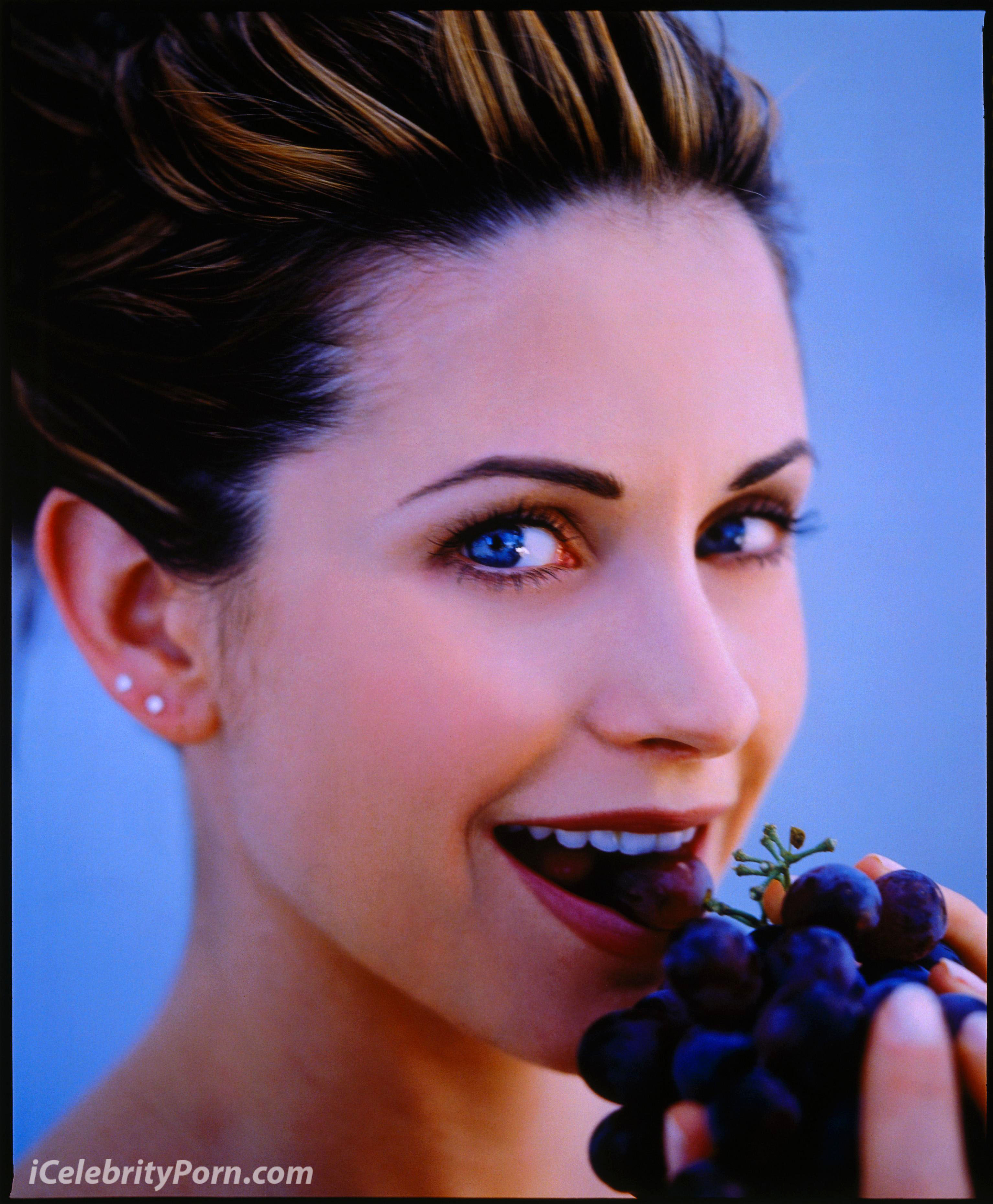 01 Jul 1996 --- Courteney Cox Eating Grapes --- Image by © Mark Seliger/CORBIS OUTLINE